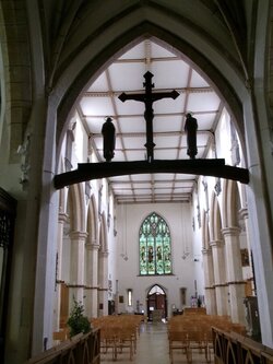 230804-0785 Minchinhampton - Holy Trinity rood-nave-W window from chancel.JPG