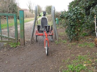 Sinner trike and A frame barrier.JPG