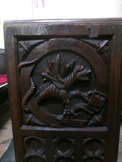 240812-7909 Chedzoy St Mary the Virgin-carved bench end-Wyvern.JPG